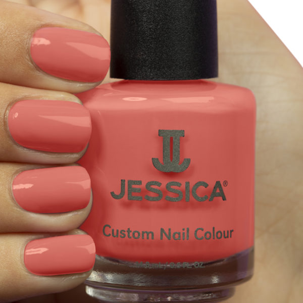 Manicured hand holding a bottle of Sensual Custom Colour Nail Polish and wearing it
