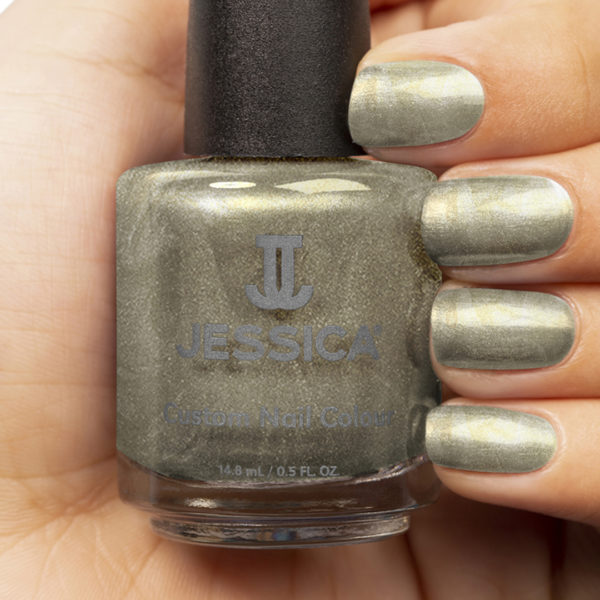 Manicured hands holding a bottle of Champagne Bubbles Custom Colour Nail Polish and wearing it