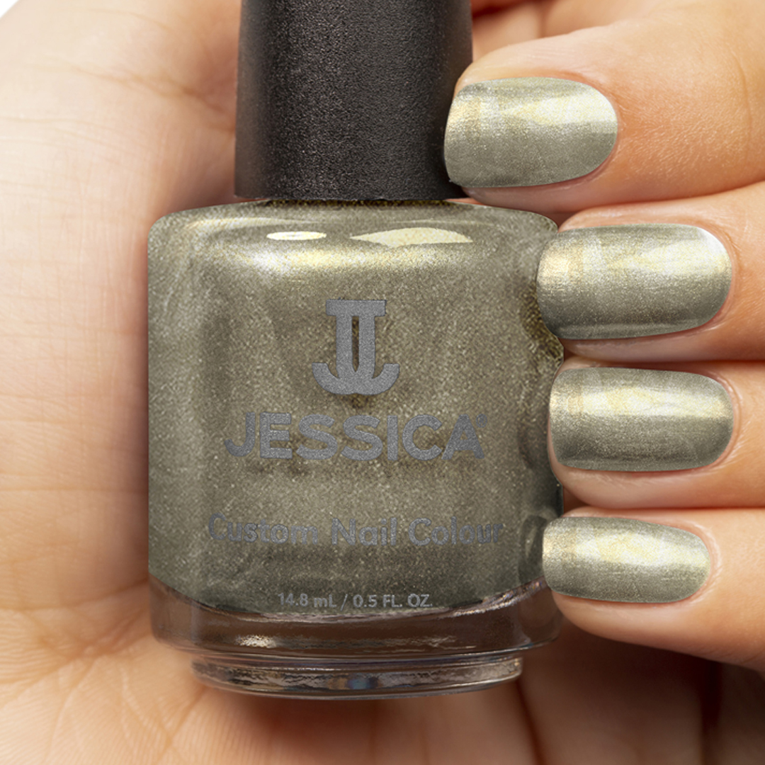 Manicured hands holding a bottle of Champagne Bubbles Custom Colour Nail Polish and wearing it