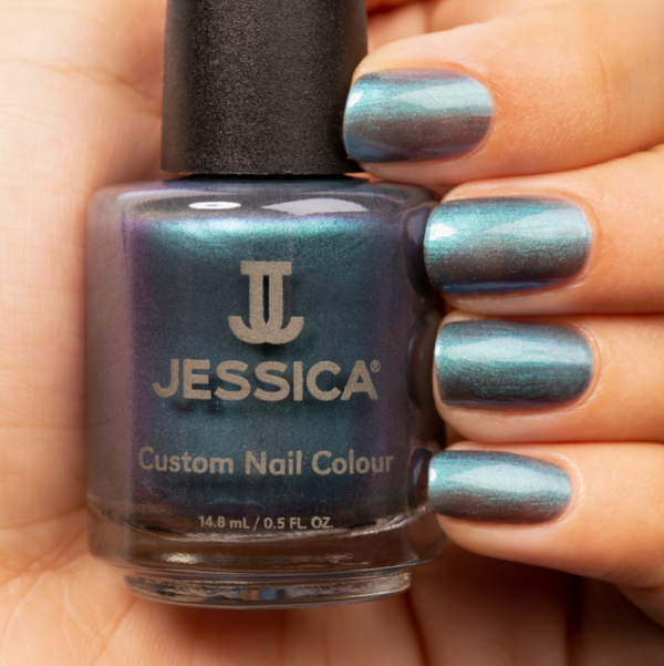 Manicured hands wearing and holding Tini Bikini Custom Colour Nail Polish