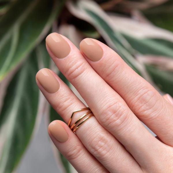 Model wearing Sweet As Honey nail polish